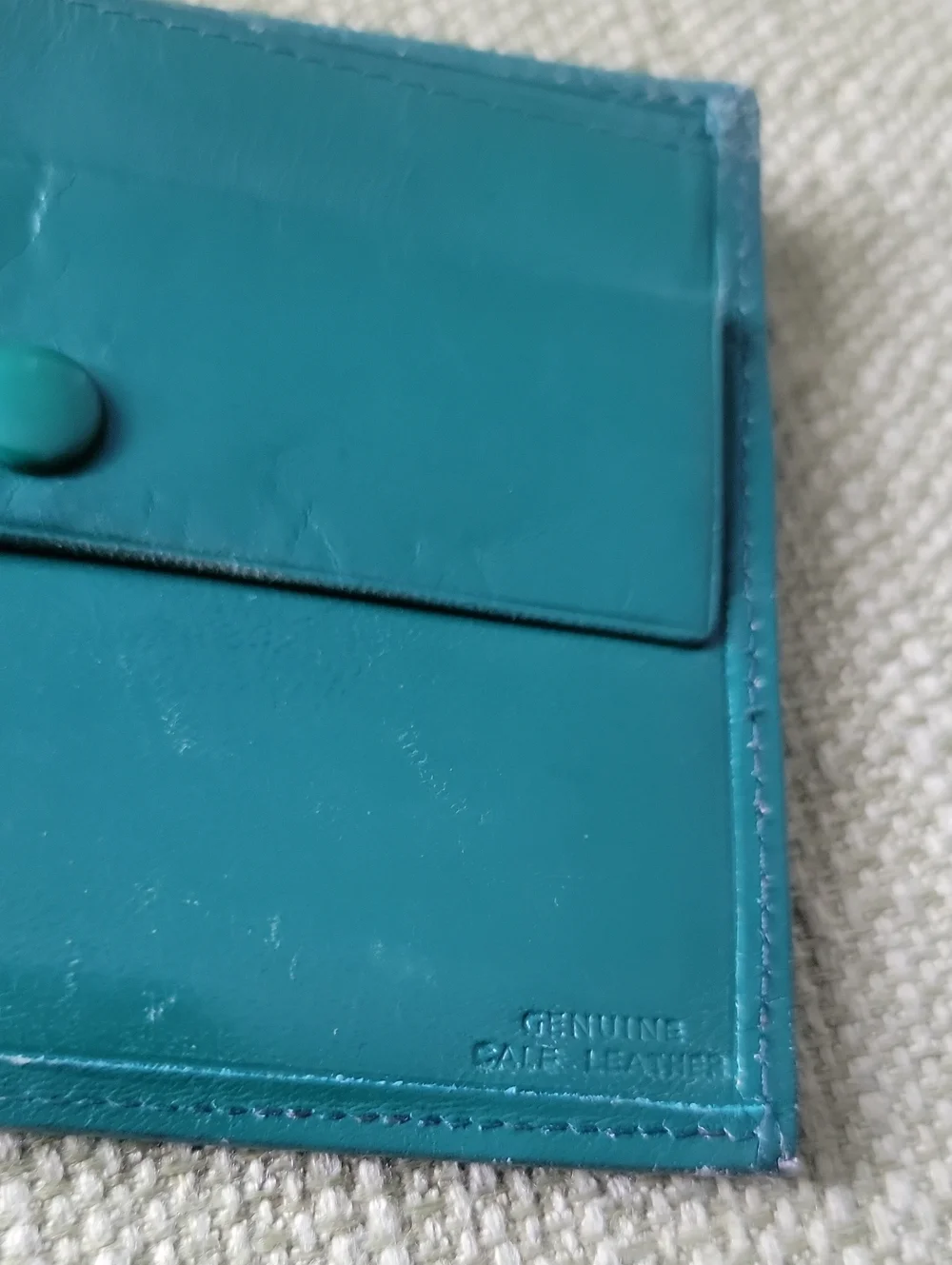 Green Leather Bifold Wallet with Gold Goat Accent